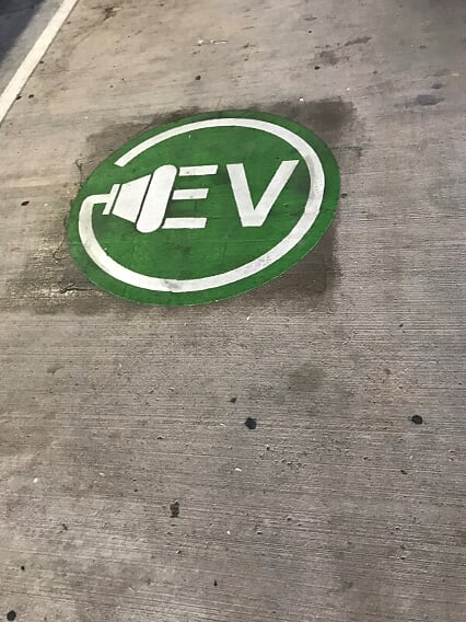 Green electric car plug in pavement marking Wildwood, Missouri